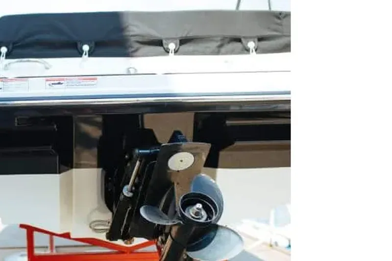Outboard drive and propeller serviced dockside by a mobile marine mechanic